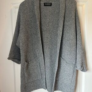 The Skinny. Woman’s classic knit cardigan. Medium Thigh length. Cozy , casual .